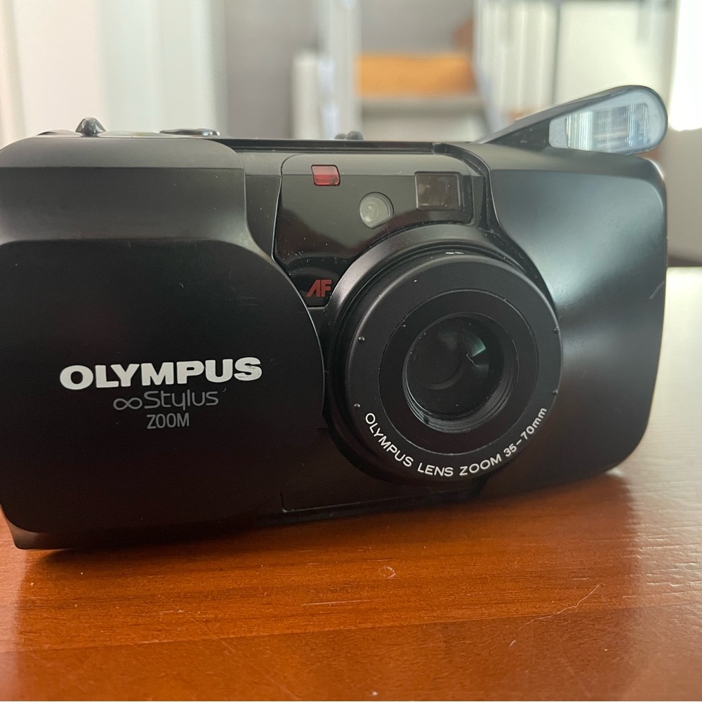 Olympus Stylus Zoom point and shoot 35mm film camera.